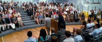 Movie still from “Crazy, Stupid, Love.” (2011), directed by Glenn Ficarra – A crowd of people sitting in front of a podium; Wide shot, High angle