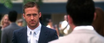 Movie still from “Crazy, Stupid, Love.” (2011), directed by Glenn Ficarra – A person wearing a suit and a tie; Close Up shot, Over the shoulder angle