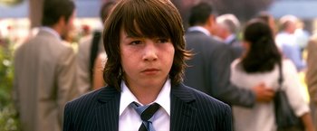 Movie still from “Crazy, Stupid, Love.” (2011), directed by Glenn Ficarra – A young man in a suit and a tie; Close Up shot, High angle