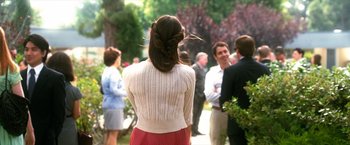 Movie still from “Crazy, Stupid, Love.” (2011), directed by Glenn Ficarra – A group of people standing in a park with trees in the background; Medium shot, Over the shoulder angle