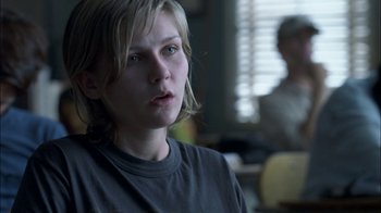 Movie still from “Crazy/Beautiful” (2001), directed by John Stockwell – A young woman is sitting in front of a window; Close Up shot, Over the shoulder angle