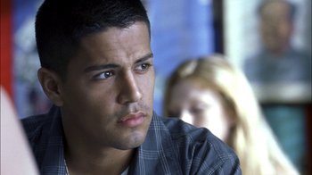 Movie still from “Crazy/Beautiful” (2001), directed by John Stockwell – A man sitting in front of a woman in front of a window; Close Up shot, Low angle