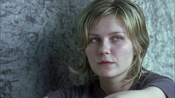 Movie still from “Crazy/Beautiful” (2001), directed by John Stockwell – A person with long blonde hair; Close Up shot, Over the shoulder angle