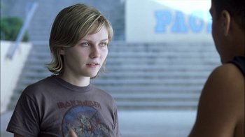 Movie still from “Crazy/Beautiful” (2001), directed by John Stockwell – A young woman with long hair wearing a t - shirt; Close Up shot, Over the shoulder angle