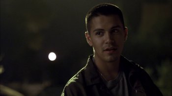 Movie still from “Crazy/Beautiful” (2001), directed by John Stockwell – A young man is standing in front of the moon; Close Up shot, Over the shoulder angle