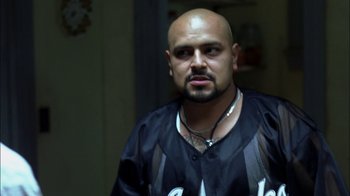 Movie still from “Crazy/Beautiful” (2001), directed by John Stockwell – A man with a bald head wearing a black shirt; Close Up shot, Over the shoulder angle