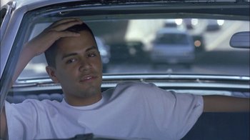 Movie still from “Crazy/Beautiful” (2001), directed by John Stockwell – A man sitting in the back seat of a car; Close Up shot, Over the shoulder angle