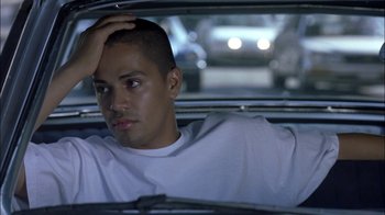 Movie still from “Crazy/Beautiful” (2001), directed by John Stockwell – A man sitting in the back seat of a car; Close Up shot, High angle