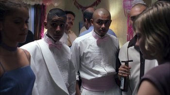 Movie still from “Crazy/Beautiful” (2001), directed by John Stockwell – A couple of men standing next to each other in a room; Medium shot, Low angle