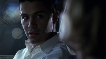 Movie still from “Crazy/Beautiful” (2001), directed by John Stockwell – A person wearing a white dress shirt; Close Up shot, Over the shoulder angle