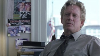 Movie still from “Crazy/Beautiful” (2001), directed by John Stockwell – A person sitting in a chair wearing a tie; Close Up shot, Over the shoulder angle