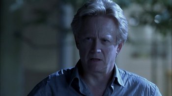 Movie still from “Crazy/Beautiful” (2001), directed by John Stockwell – An older man with white hair is looking at the camera; Close Up shot, Over the shoulder angle