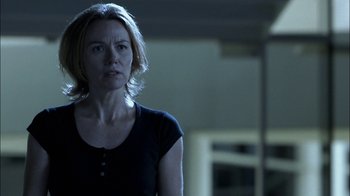 Movie still from “Crazy/Beautiful” (2001), directed by John Stockwell – A woman standing in a dark room looking at the camera; Close Up shot, Low angle