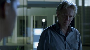 Movie still from “Crazy/Beautiful” (2001), directed by John Stockwell – A man standing in a room with a light in the background; Close Up shot, Over the shoulder angle