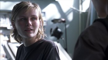Movie still from “Crazy/Beautiful” (2001), directed by John Stockwell – A young woman is standing in front of a camera; Close Up shot, Over the shoulder angle