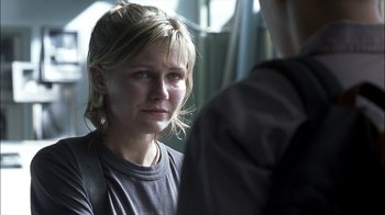 Movie still from “Crazy/Beautiful” (2001), directed by John Stockwell – A young woman looking sad while talking to a man; Close Up shot, Over the shoulder angle