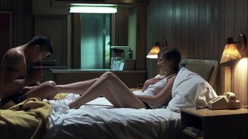 Movie still from “Crazy/Beautiful” (2001), directed by John Stockwell – A woman laying on a bed in a room; Wide shot, High angle