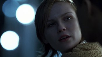 Movie still from “Crazy/Beautiful” (2001), directed by John Stockwell – A woman's face with a light shining on it; Close Up shot, Over the shoulder angle