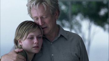 Movie still from “Crazy/Beautiful” (2001), directed by John Stockwell – An older man and a young girl embracing each other; Close Up shot, Over the shoulder angle