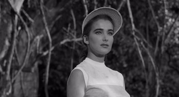 Movie still from “Creature from the Black Lagoon” (1954), directed by Jack Arnold – Black and white photograph of a woman wearing a hat; Close Up shot, Low angle