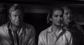 Movie still from “Creature from the Black Lagoon” (1954), directed by Jack Arnold – A black and white photo of a man and a woman; Close Up shot, Over the shoulder angle