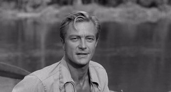 Movie still from “Creature from the Black Lagoon” (1954), directed by Jack Arnold – Black and white photograph of a man in a shirt; Close Up shot, Over the shoulder angle
