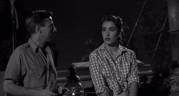 Movie still from “Creature from the Black Lagoon” (1954), directed by Jack Arnold – A man and a woman sitting next to each other; Medium shot, Over the shoulder angle