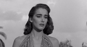 Movie still from “Creature from the Black Lagoon” (1954), directed by Jack Arnold – Black and white photograph of a woman in a halter top; Close Up shot, Low angle