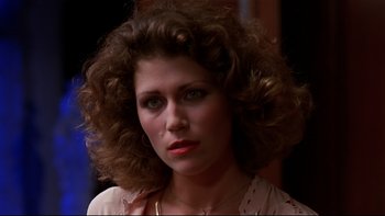 Movie still from “Creepshow” (1982), directed by George A. Romero – A person with curly hair; Close Up shot, Low angle