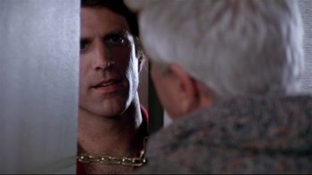 Movie still from “Creepshow” (1982), directed by George A. Romero – A man looking at himself in the mirror; Close Up shot, Over the shoulder angle