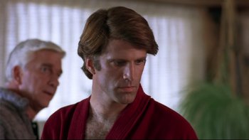 Movie still from “Creepshow” (1982), directed by George A. Romero – A person wearing a robe; Close Up shot, Over the shoulder angle