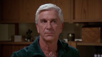 Movie still from “Creepshow” (1982), directed by George A. Romero – An older man with white hair is looking at the camera; Close Up shot, Low angle
