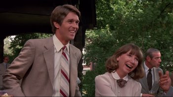 Movie still from “Creepshow” (1982), directed by George A. Romero – A man and a woman laughing together outside; Medium shot, Low angle