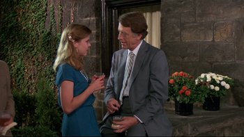 Movie still from “Creepshow” (1982), directed by George A. Romero – A man and a woman talking to each other outside; Medium shot, Over the shoulder angle
