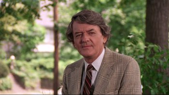 Movie still from “Creepshow” (1982), directed by George A. Romero – An older man in a suit and a tie; Close Up shot, Low angle