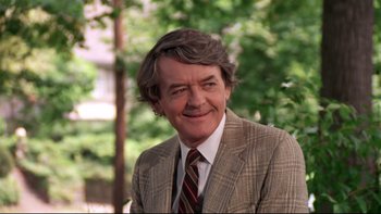 Movie still from “Creepshow” (1982), directed by George A. Romero – A person wearing a suit and tie; Close Up shot, Low angle