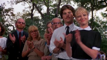 Movie still from “Creepshow” (1982), directed by George A. Romero – A group of people clapping in a crowd; Medium shot, Low angle