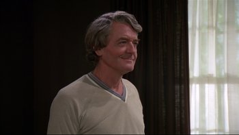 Movie still from “Creepshow” (1982), directed by George A. Romero – A person with long grey hair; Close Up shot, Over the shoulder angle