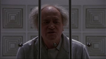 Movie still from “Creepshow” (1982), directed by George A. Romero – An old man in a jail cell looking at the camera; Close Up shot, Low angle