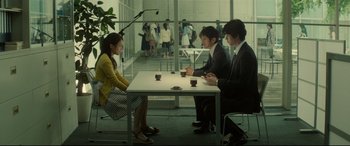 A group of people sitting around a table