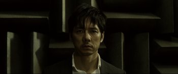 A person wearing a suit and tie
