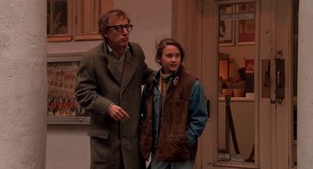 Movie still from “Crimes and Misdemeanors” (1989), directed by Woody Allen – A man standing next to a young girl; Medium shot, Over the shoulder angle