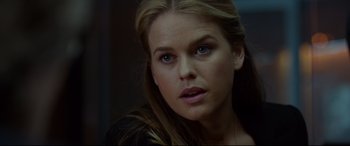 Movie still from “Criminal” (2016), directed by Ariel Vromen – A person with long blonde hair; Close Up shot, Over the shoulder angle