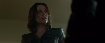 Movie still from “Criminal” (2016), directed by Ariel Vromen – A person wearing a leather jacket; Close Up shot, Over the shoulder angle