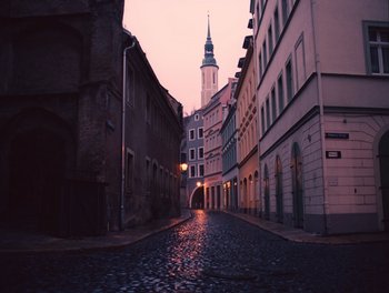 Movie still from “The Grand Budapest Hotel” (2014), directed by Wes Anderson – An empty street in the middle of a city; Extreme Wide shot, High angle