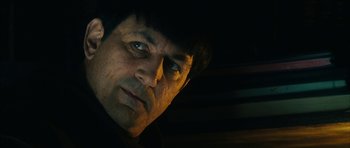 Movie still from “Crimson Rivers 2: Angels of the Apocalypse” (2004), directed by Olivier Dahan – A person wearing a hat; Close Up shot, Low angle