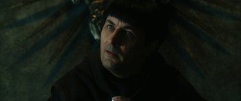 Movie still from “Crimson Rivers 2: Angels of the Apocalypse” (2004), directed by Olivier Dahan – A person wearing a suit and tie; Close Up shot, High angle