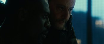 Movie still from “Crimson Rivers 2: Angels of the Apocalypse” (2004), directed by Olivier Dahan – A man and a black man looking at one another; Close Up shot, Over the shoulder angle