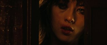 Movie still from “Crimson Rivers 2: Angels of the Apocalypse” (2004), directed by Olivier Dahan – A woman's face in the dark; Close Up shot, Low angle
