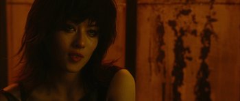 Movie still from “Crimson Rivers 2: Angels of the Apocalypse” (2004), directed by Olivier Dahan – A person wearing a dress; Close Up shot, Over the shoulder angle